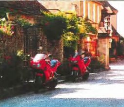Two Red Honda VFR's parked outside Hotel L'Esplanade in Domme